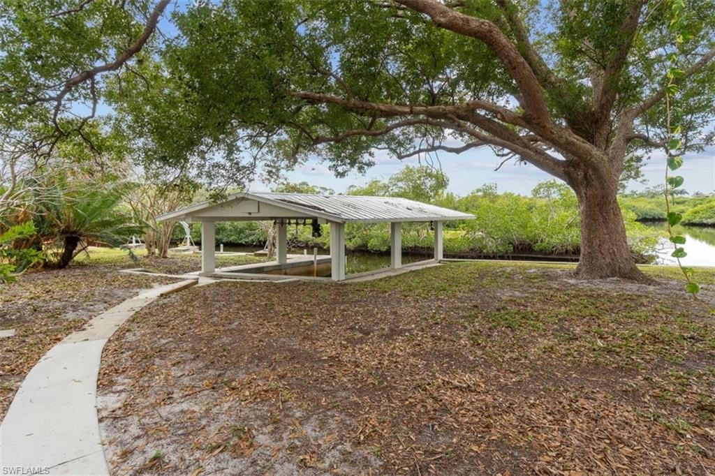 4851 Riverside Drive Estero, FL 33928 - Photo 30 of 35 a view of house with outdoor entertaining space