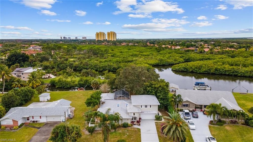 4851 Riverside Drive Estero, FL 33928 - Photo 33 of 35 an aerial view of a house with a lake view