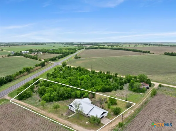 a view of a balcony with wooden floor and lake view
