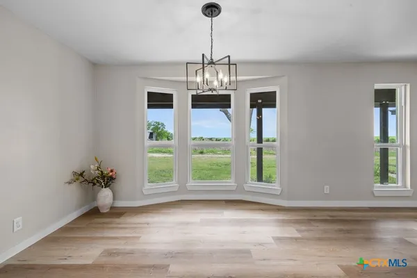 a view of an entryway with wooden floor