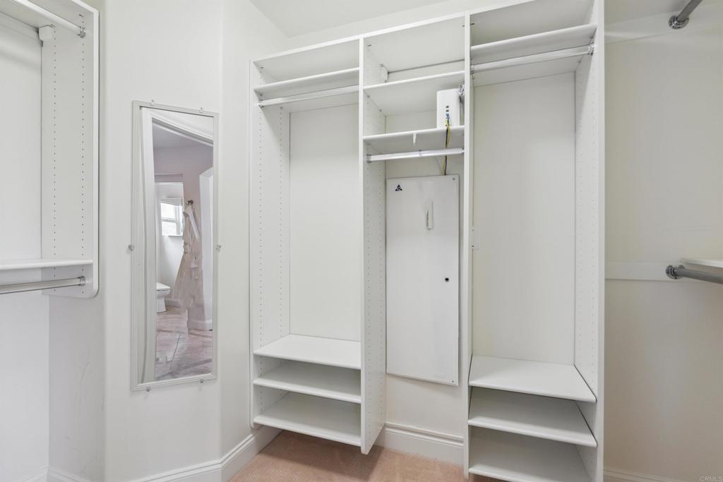 848 Prospect Street, Unit C La Jolla, CA 92037 - Photo 11 of 24 a view of walk in closet with empty racks