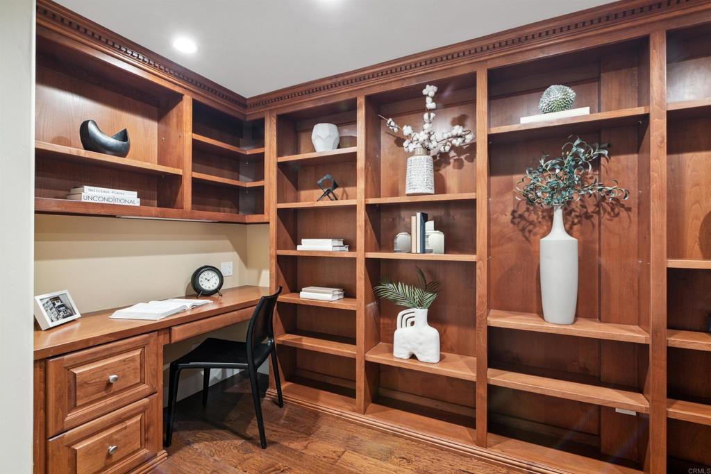 848 Prospect Street, Unit C La Jolla, CA 92037 - Photo 20 of 24 a view of room with cabinets and book shelf