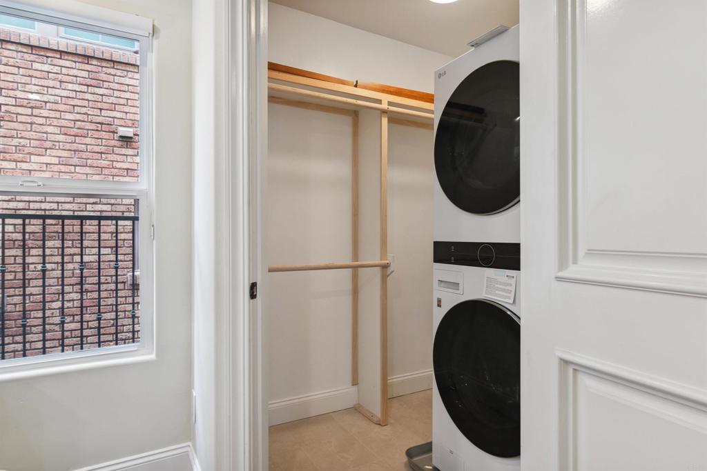 848 Prospect Street, Unit C La Jolla, CA 92037 - Photo 21 of 24 a close view of a utility room with dryer and washer