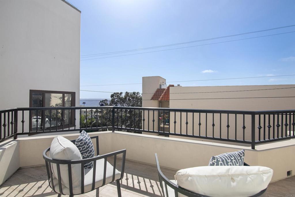 848 Prospect Street, Unit C La Jolla, CA 92037 - Photo 3 of 24 a balcony with table and chairs