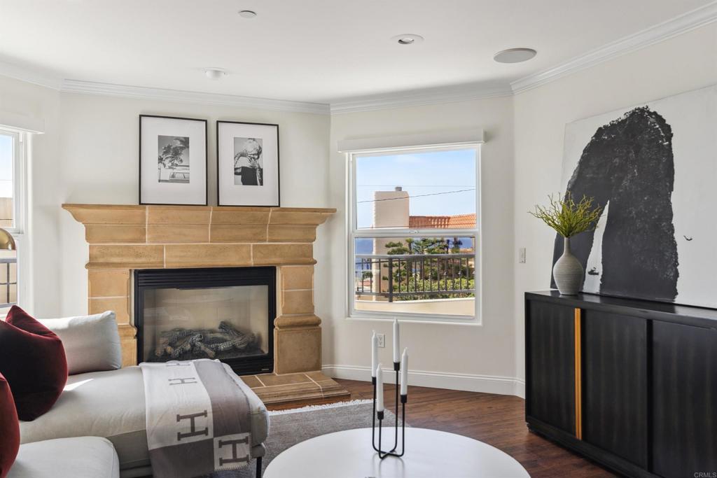 848 Prospect Street, Unit C La Jolla, CA 92037 - Photo 4 of 24 a living room with furniture and a fireplace