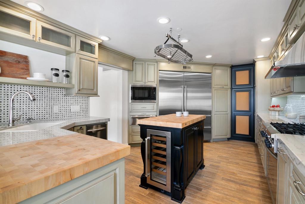 848 Prospect Street, Unit C La Jolla, CA 92037 - Photo 6 of 24 a kitchen that has a lot of cabinets in it