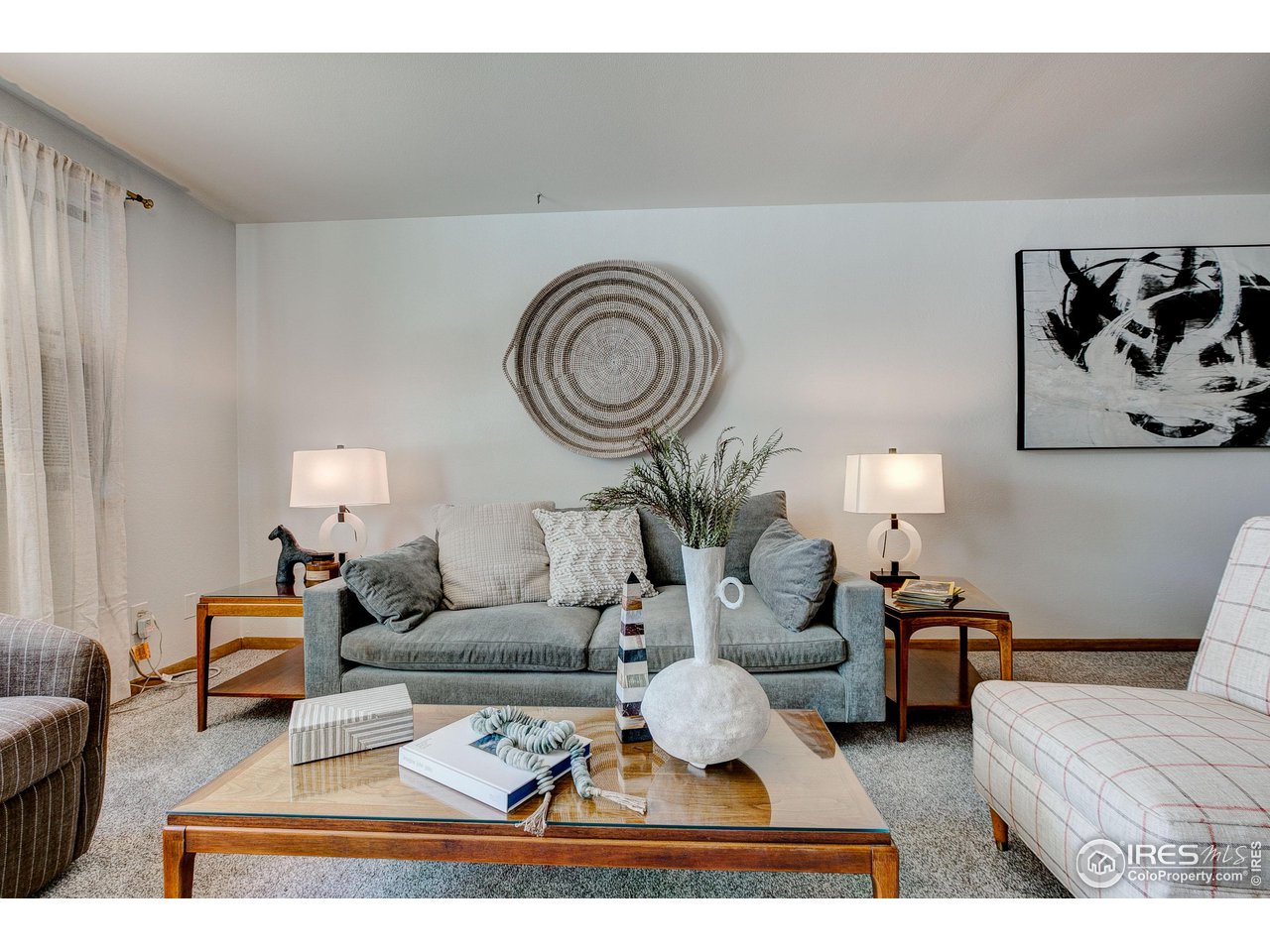 620 West Myrtle Street Fort Collins, CO 80521 - Photo 11 of 30 a living room with furniture a rug and a wall painting