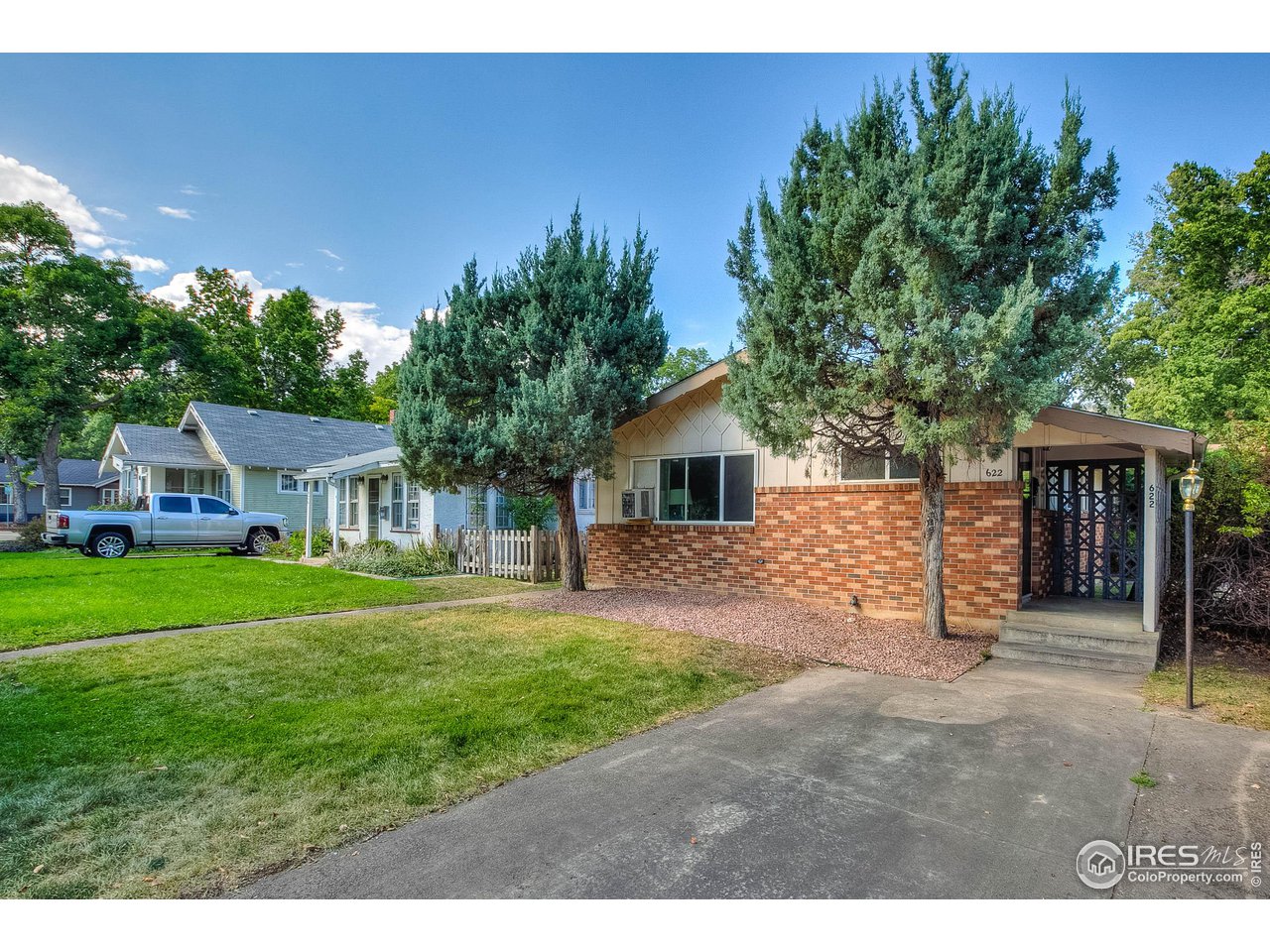 620 West Myrtle Street Fort Collins, CO 80521 - Photo 2 of 30 a front view of a house with a yard and garage