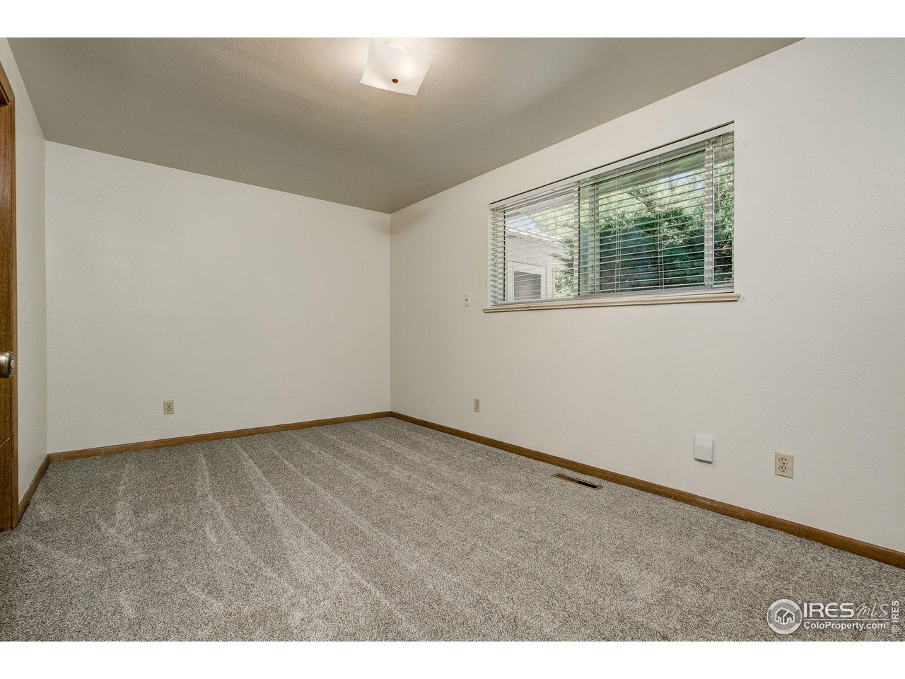 620 West Myrtle Street Fort Collins, CO 80521 - Photo 25 of 30 a view of an empty room with a window