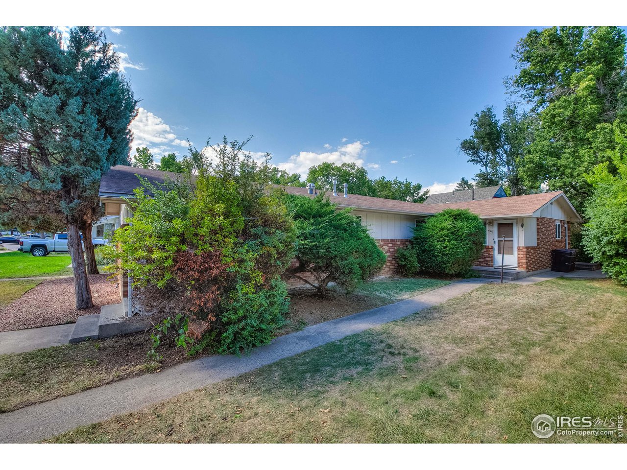 620 West Myrtle Street Fort Collins, CO 80521 - Photo 4 of 30 a view of a house with a yard and a street