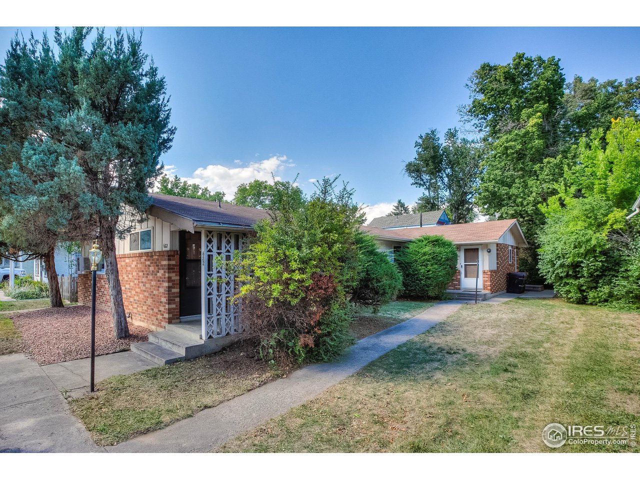620 West Myrtle Street Fort Collins, CO 80521 - Photo 5 of 30 a front view of a house with garden