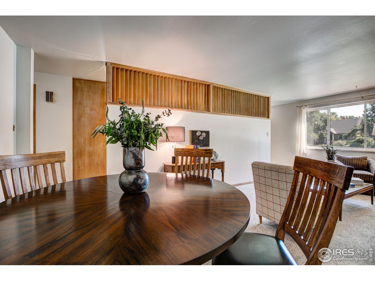 620 West Myrtle Street Fort Collins, CO 80521 - Photo 9 of 30 a dining room with furniture potted plants and wooden floor