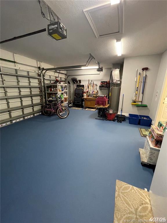 4513 Southwest 185th Avenue Miramar, FL 33029 - Photo 15 of 66 a view of a garage with furniture and a car parked in it