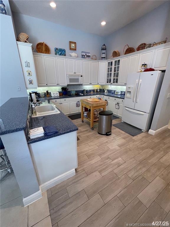 4513 Southwest 185th Avenue Miramar, FL 33029 - Photo 16 of 66 a kitchen with stainless steel appliances granite countertop a sink dishwasher stove and cabinets