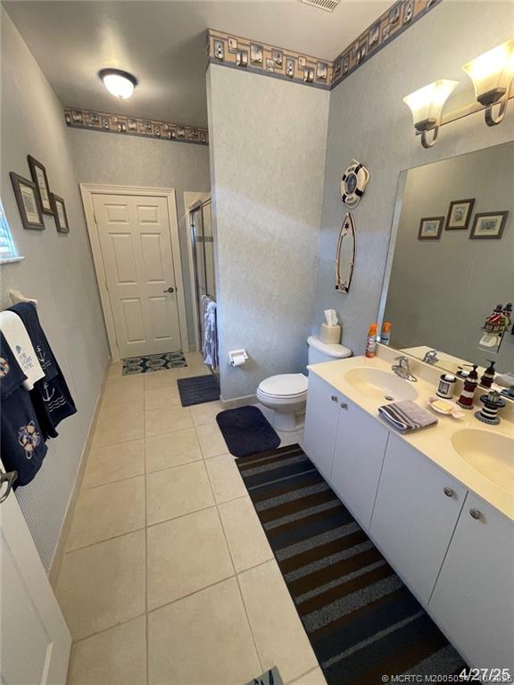 4513 Southwest 185th Avenue Miramar, FL 33029 - Photo 28 of 66 a bathroom with a sink toilet and shower