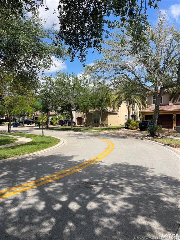4513 Southwest 185th Avenue Miramar, FL 33029 - Photo 3 of 66 a view of pool with plants and trees