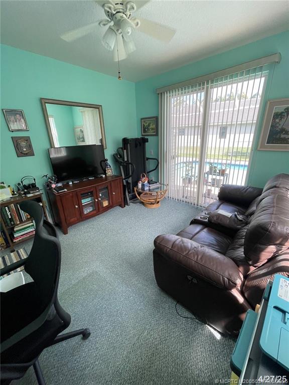 4513 Southwest 185th Avenue Miramar, FL 33029 - Photo 36 of 66 a living room with furniture and a flat screen tv