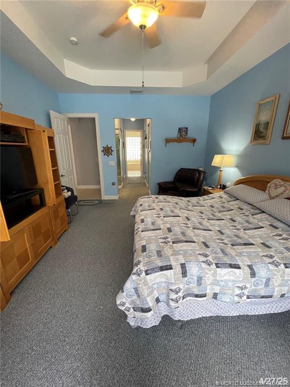 4513 Southwest 185th Avenue Miramar, FL 33029 - Photo 41 of 66 a bedroom with a bed and a chandelier