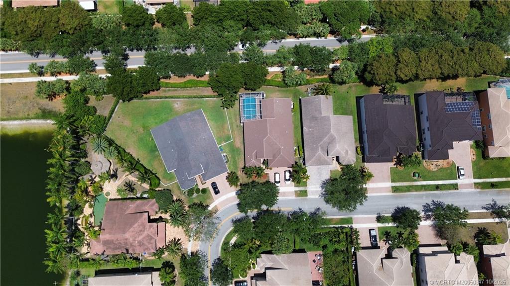 4513 Southwest 185th Avenue Miramar, FL 33029 - Photo 62 of 66 an aerial view of a house with a yard and lake view