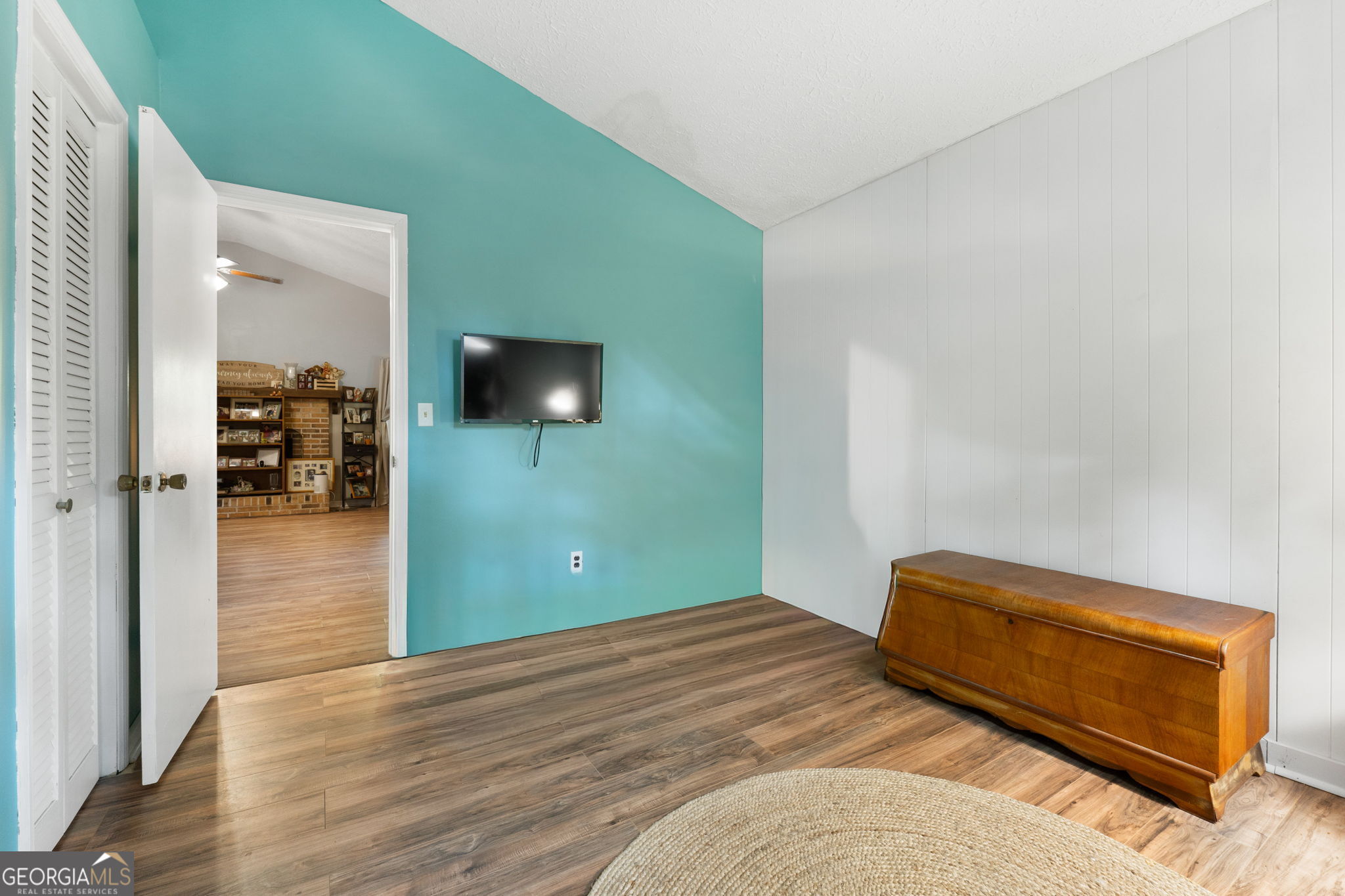 196 Horseshoe Bend Road Jackson, GA 30233 - Photo 14 of 21 a bedroom with a bed and wooden floor