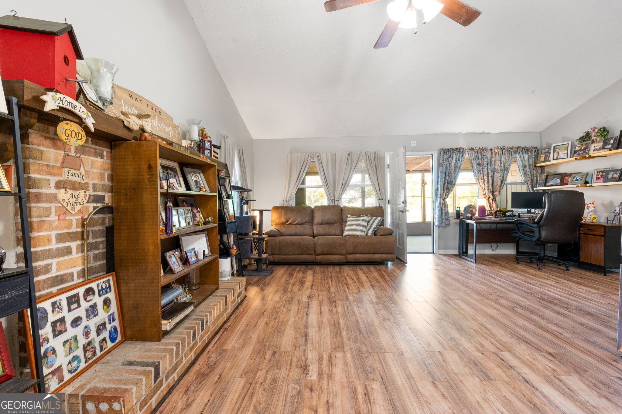 196 Horseshoe Bend Road Jackson, GA 30233 - Photo 6 of 21 a living room with furniture and a book shelf