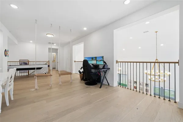 a living room with furniture and kitchen view