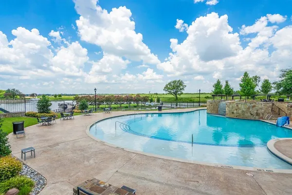 a view of a swimming pool and a chair