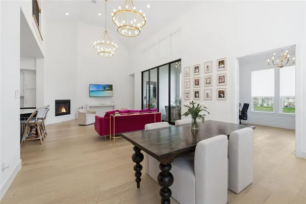 a living room with furniture a rug and a large window