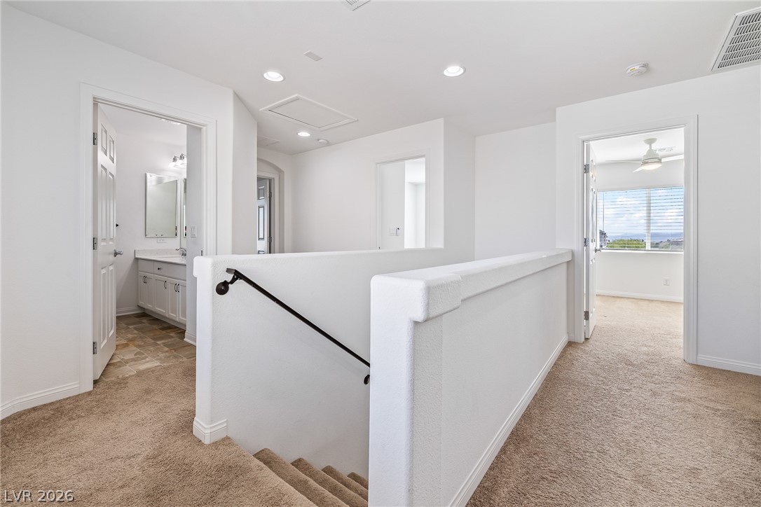 5510 Ripple Ridge Avenue Las Vegas, NV 89139 - Photo 26 of 45 This bright hallway connects spaces with clean lines and inviting views.