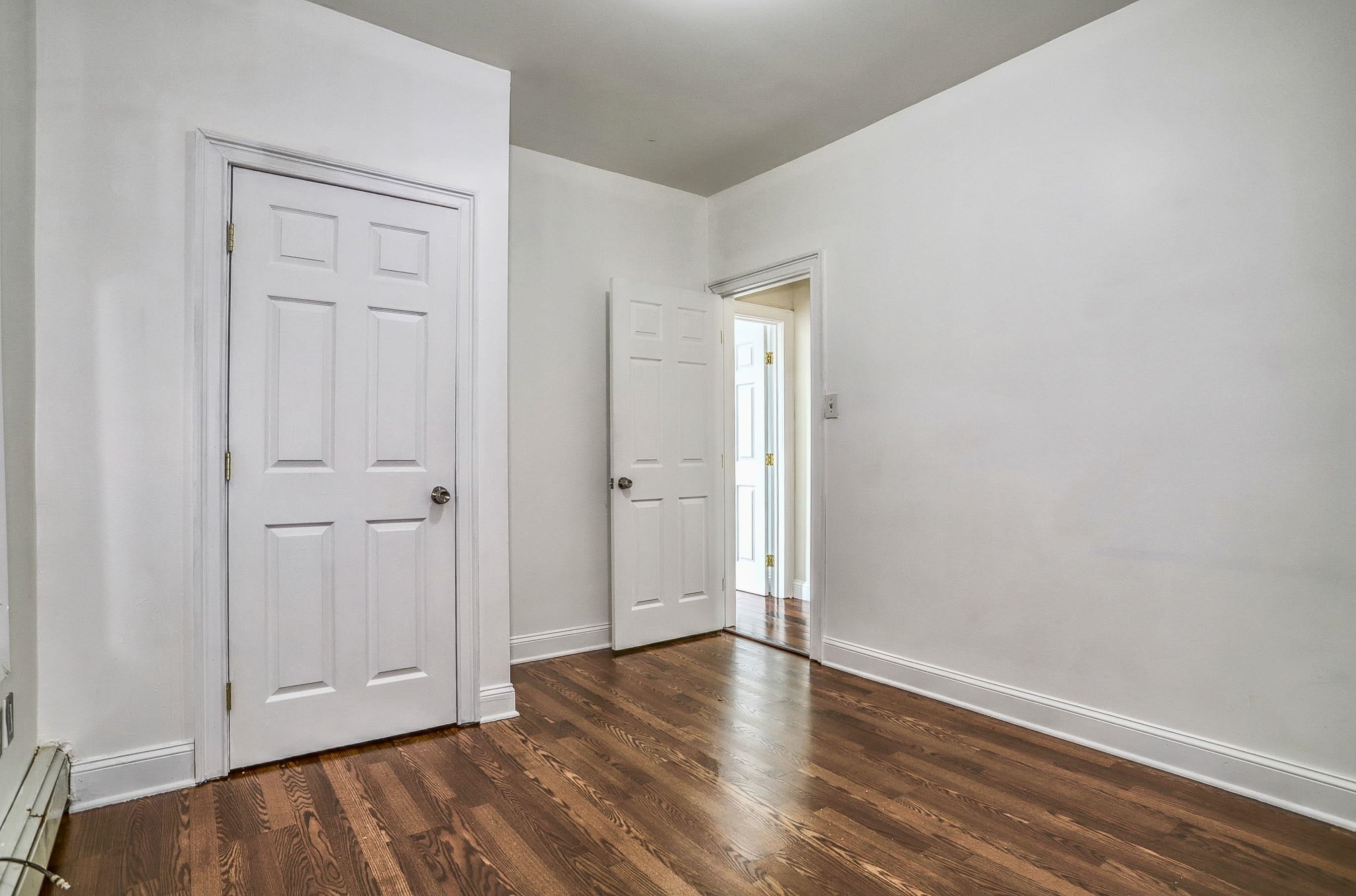 206 Dodd Street, Unit 2 Weehawken, NJ 07086 - Photo 11 of 20 a view of an empty room with closet and wooden floor