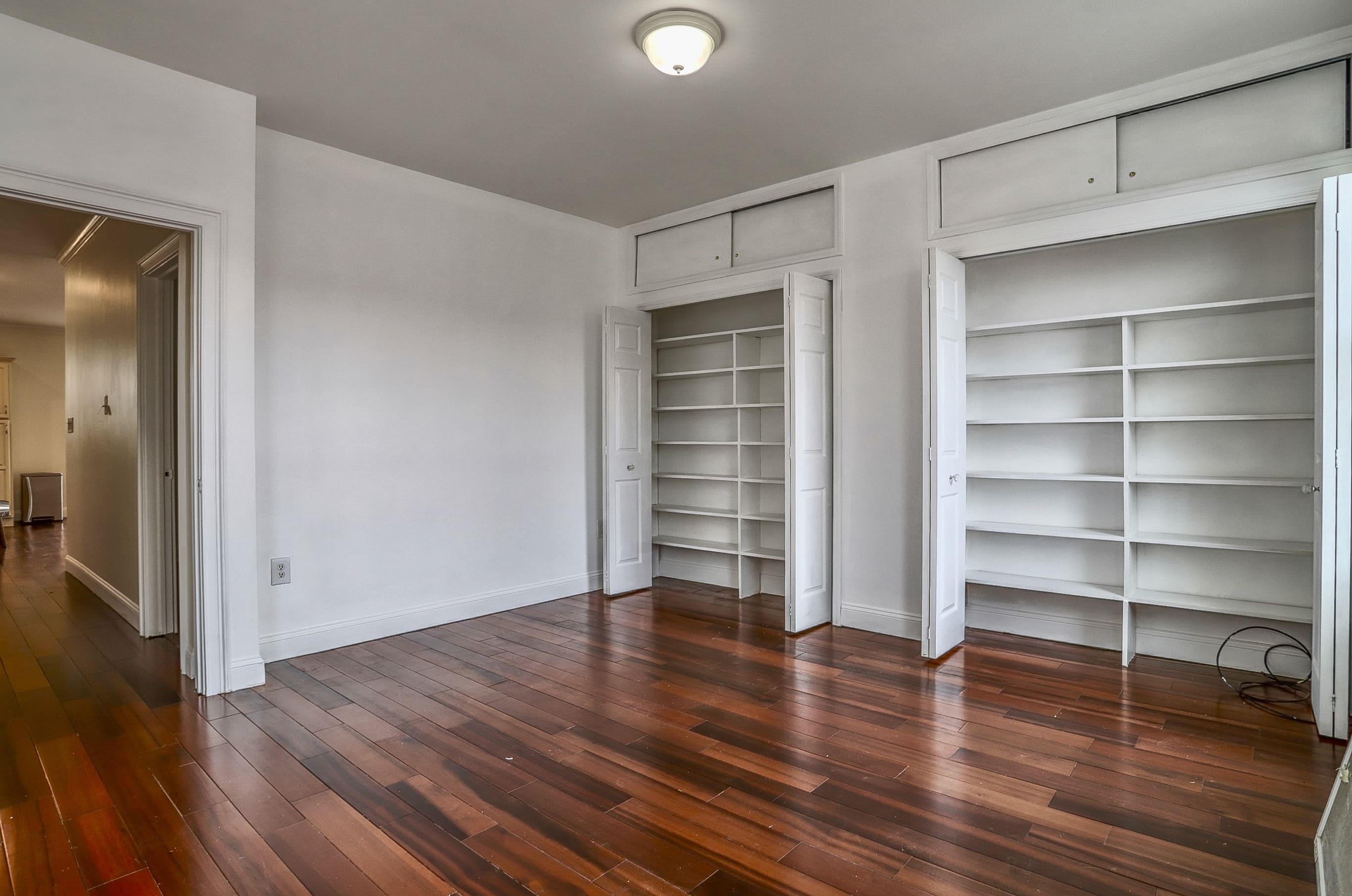 206 Dodd Street, Unit 2 Weehawken, NJ 07086 - Photo 17 of 20 a view of an empty room with a window and wooden floor