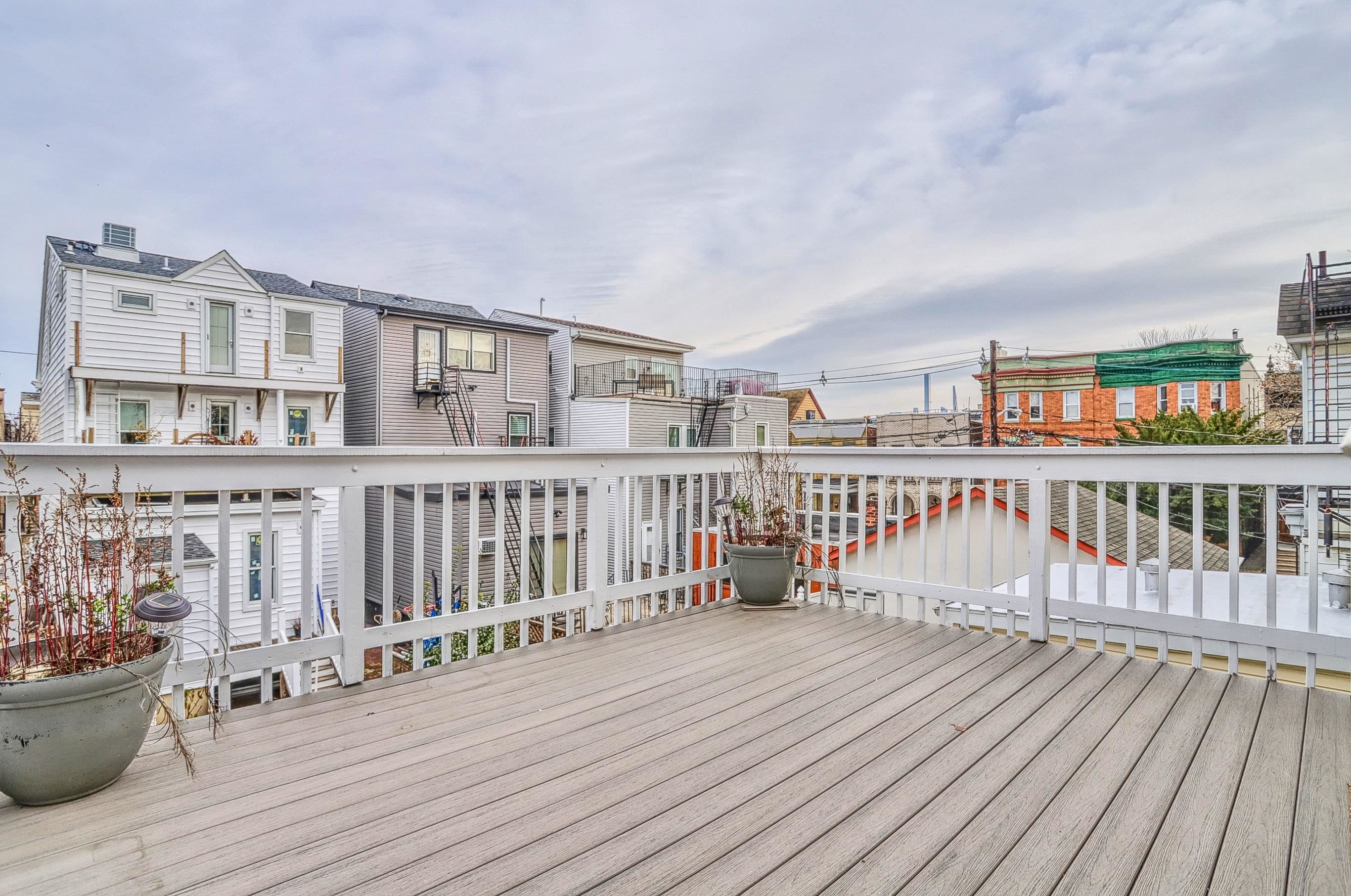 206 Dodd Street, Unit 2 Weehawken, NJ 07086 - Photo 18 of 20 a view of a balcony with wooden floor