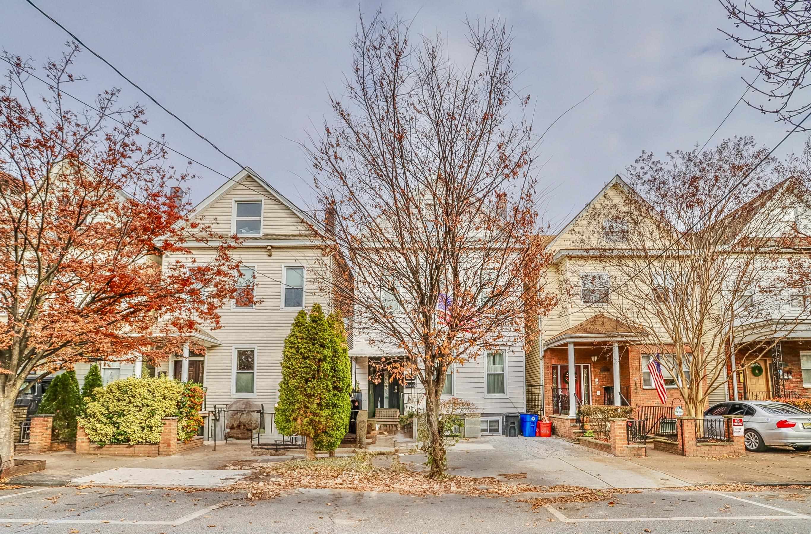 206 Dodd Street, Unit 2 Weehawken, NJ 07086 - Photo 2 of 20 a front view of a building with large trees
