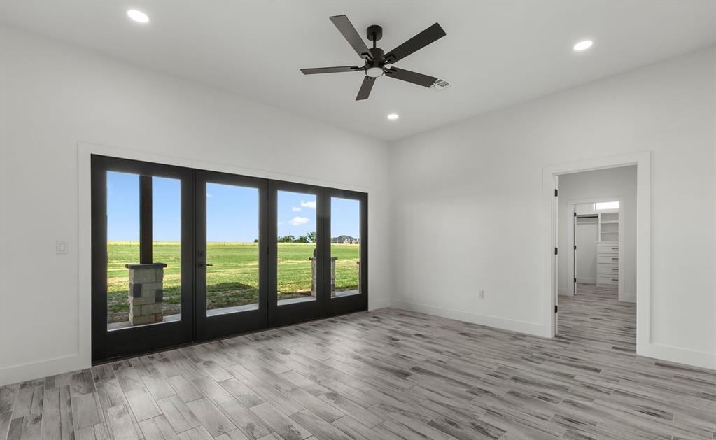 2311 Parker Road Wichita Falls, TX 76310 - Photo 18 of 32 wooden floor in an empty room with a window