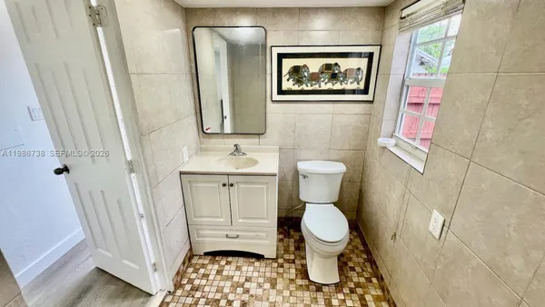 a bathroom with a toilet and a sink