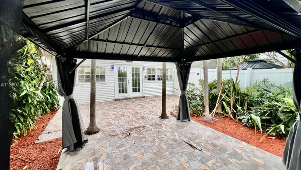 a view of a porch with wooden floor and outdoor space
