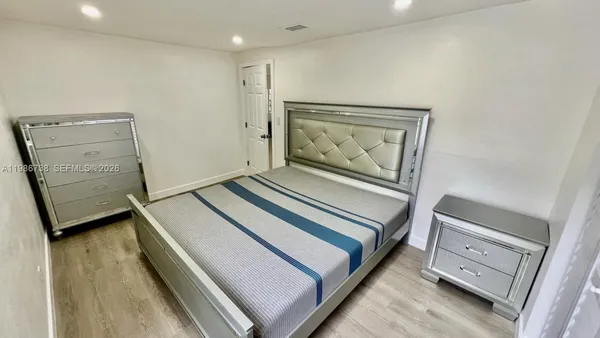 a hallway with a bed