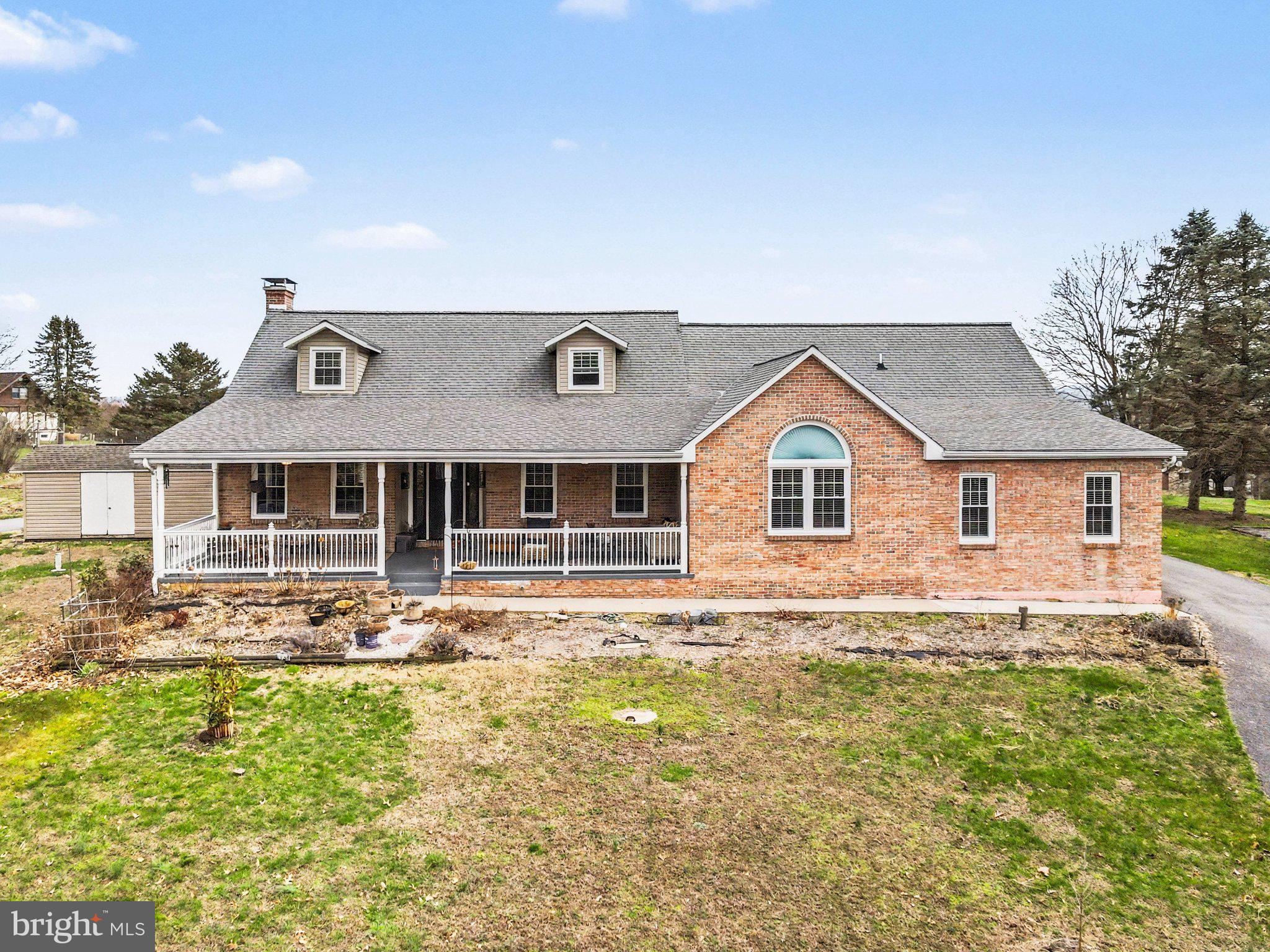 Charming brick home with spacious porch.