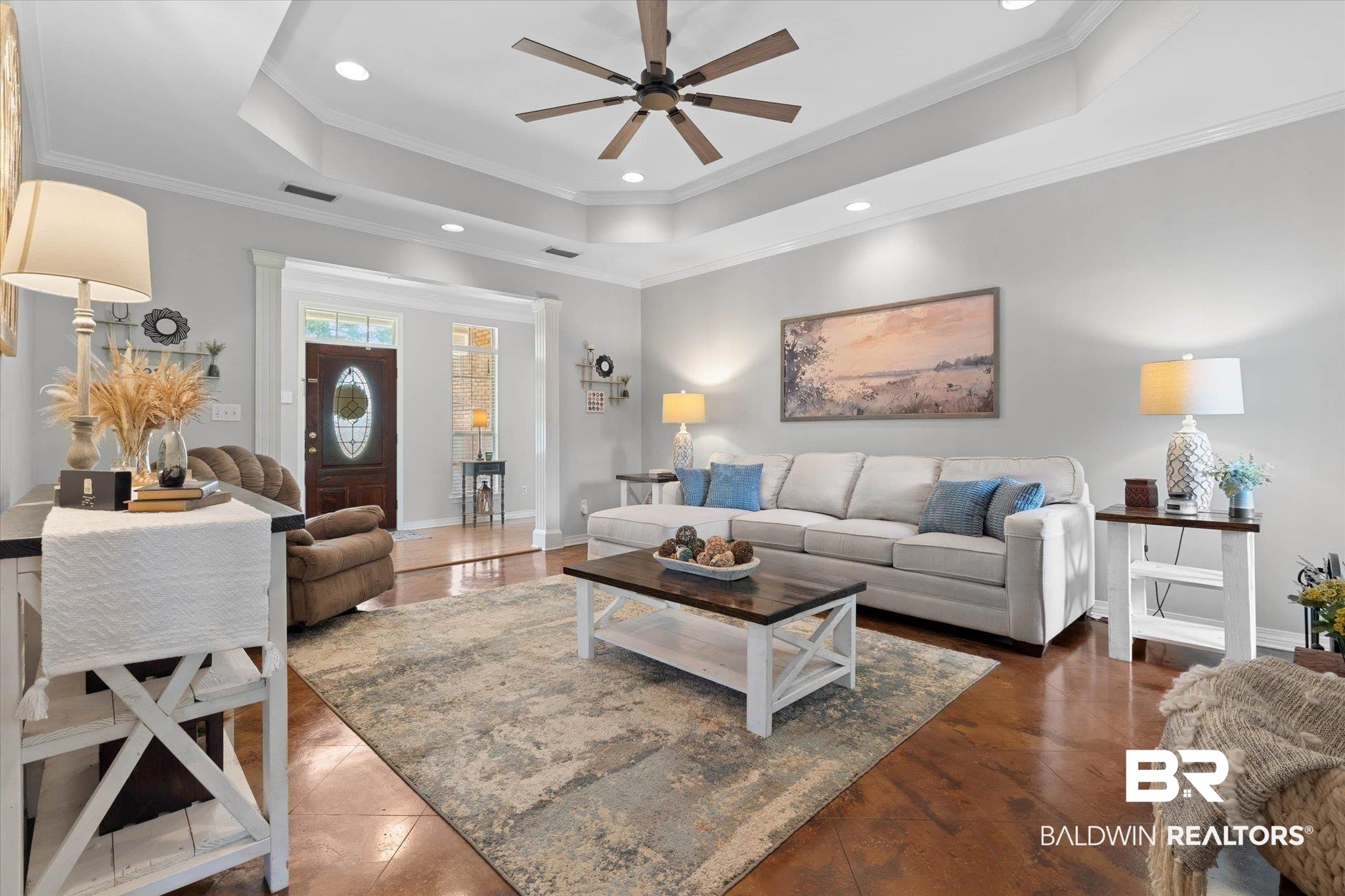 3170 Scott Dairy Loop Road West Mobile, AL 36695 - Photo 3 of 24 Spacious living area featuring wood-finish flooring, a tray ceiling with recessed lighting and a ceiling fan, and an arched entry
