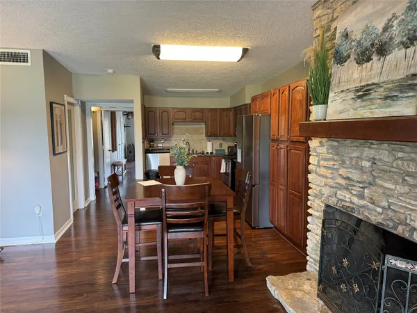 a dining room with furniture and wooden floor