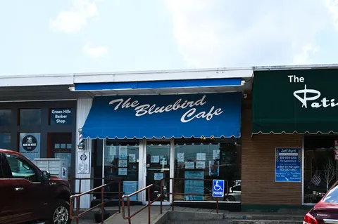 a cafe on the corner of the street