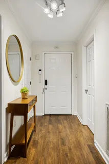 a view of a livingroom with furniture and wooden floor