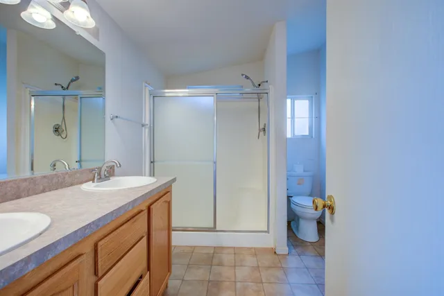 a bathroom with a sink vanity and mirror