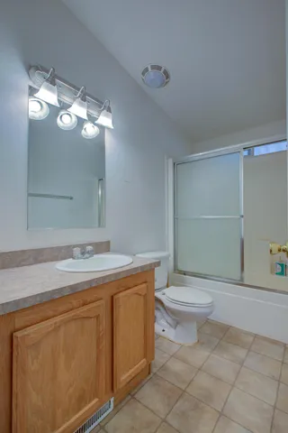 a view of hallway with wooden floor