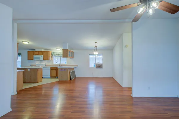 a view of a kitchen with a sink and a refrigerator
