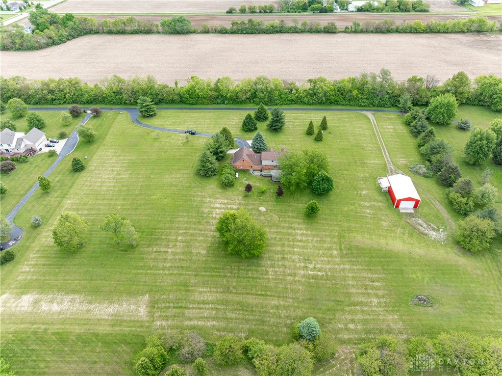 9981 Ridge Acres Lane Englewood, OH 45322 - Photo 54 of 73 Expansive green property showcasing a residence, long driveway, and a versatile outbuilding.