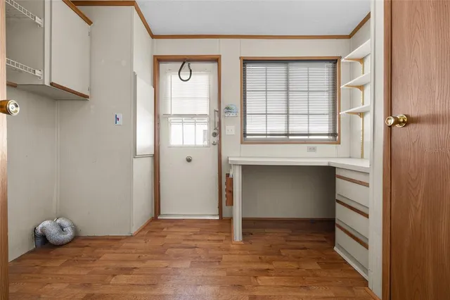 a view of an empty room with a window