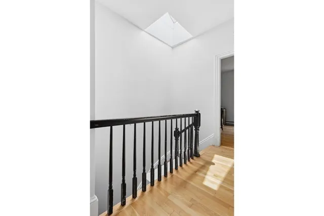 a view of a hallway with a white walls