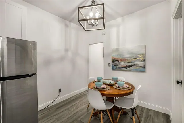 a bedroom with a bed and a potted plant