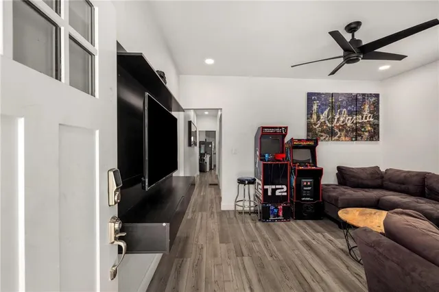 a view of a dining room with furniture and wooden floor